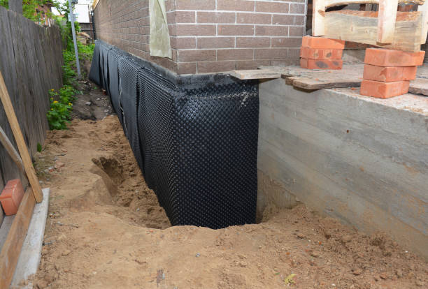 SJ Waterproofing Pros technician performing targeted Waterproofing assessment in Briggsville, WI